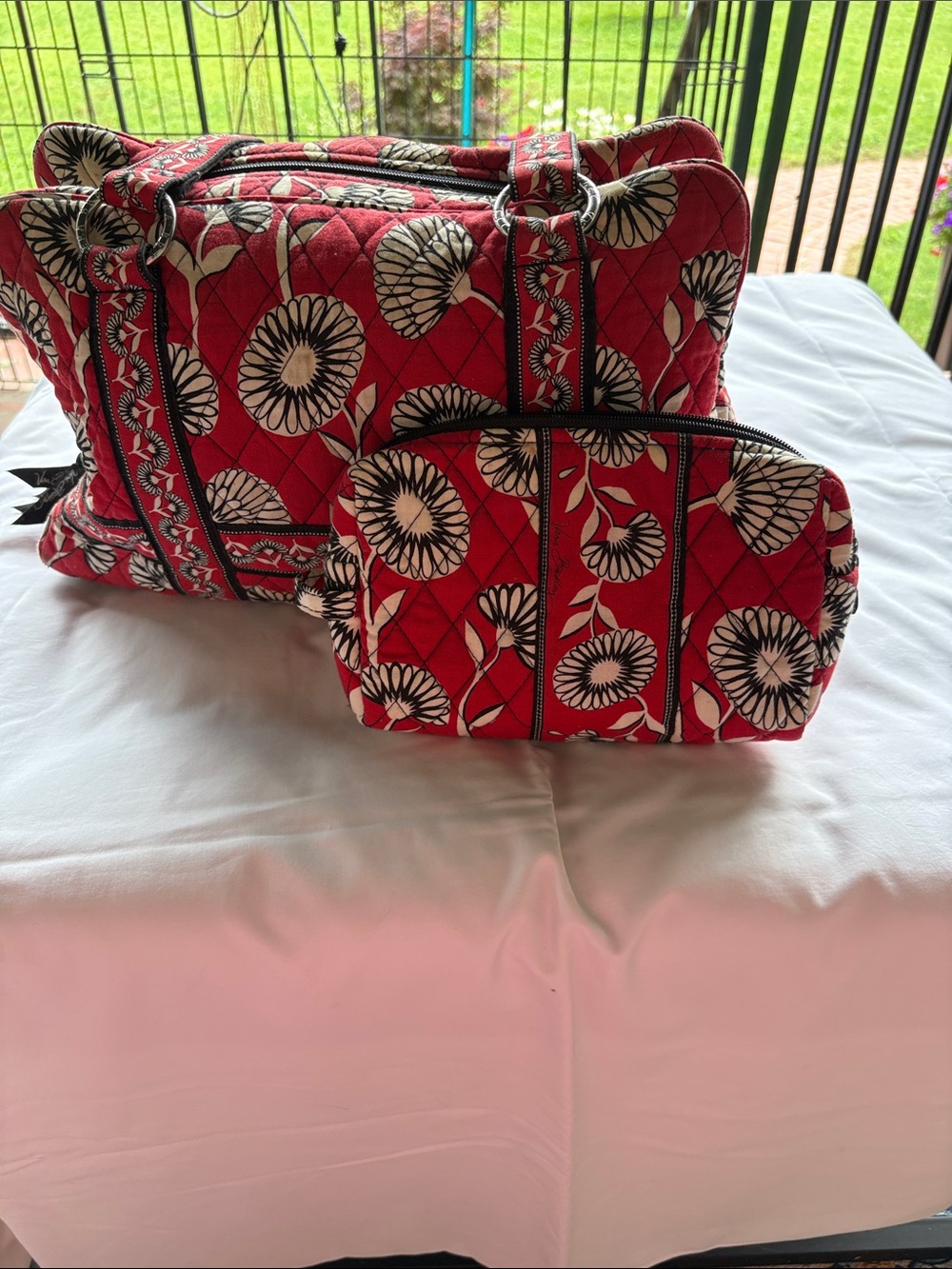 Vera Bradley tote bag with matching makeup bag in the retired “Deco Daisy”.